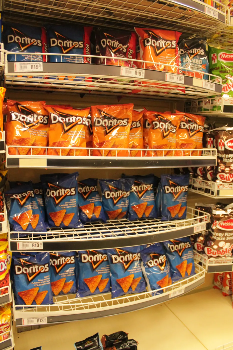 Wire basket display shelving containing snack bags